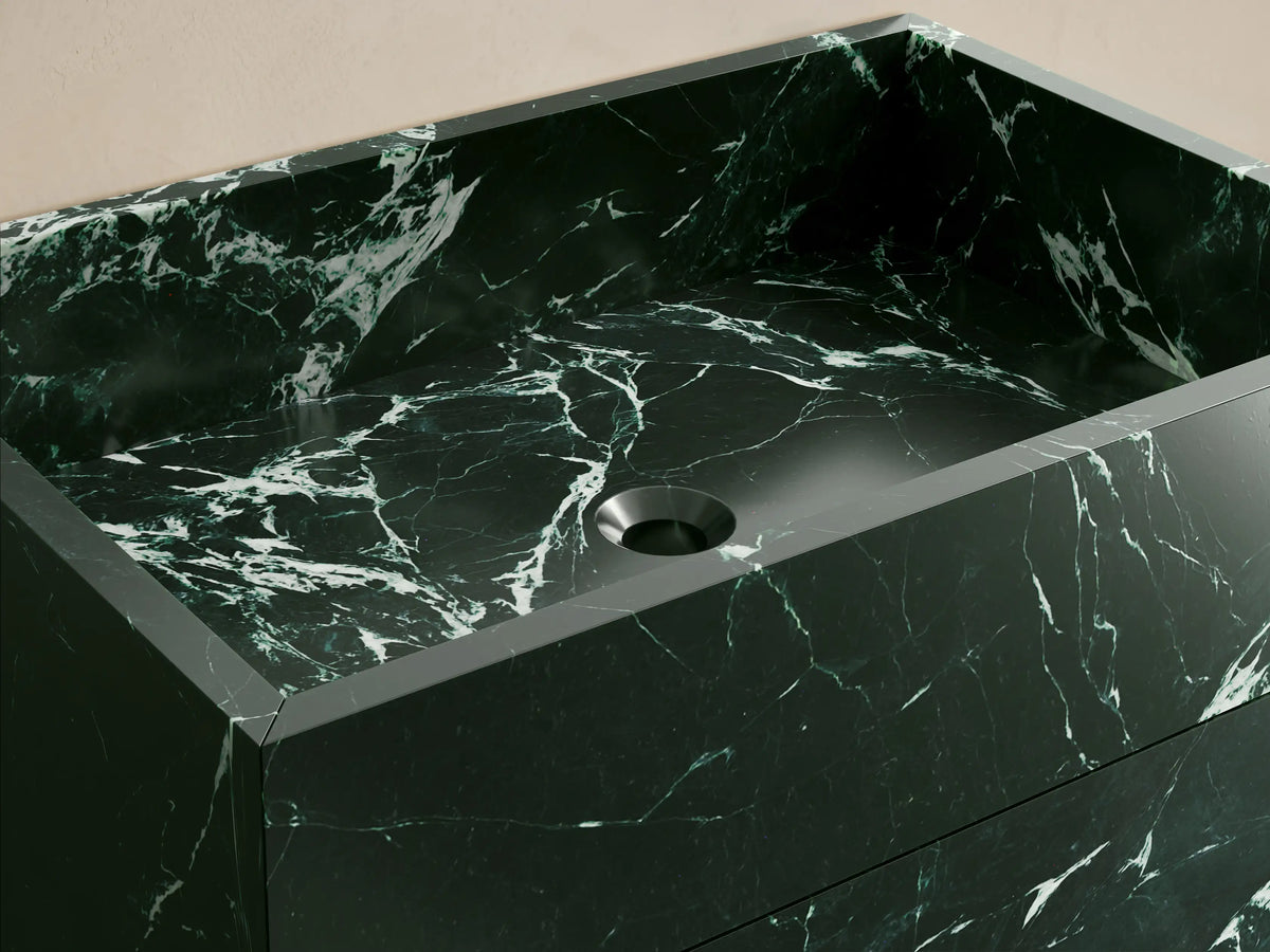Front view of the dark green natural stone Vertiz Pedestal Sink with Storage, featuring a rectangular shape and prominent white veining.
