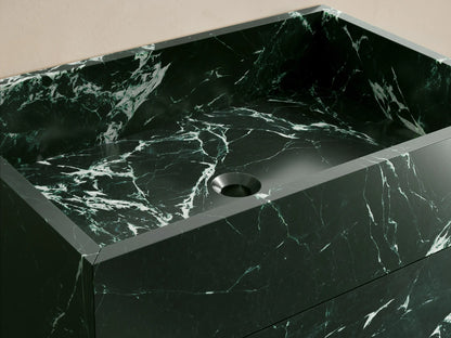 Front view of the dark green natural stone Vertiz Pedestal Sink with Storage, featuring a rectangular shape and prominent white veining.