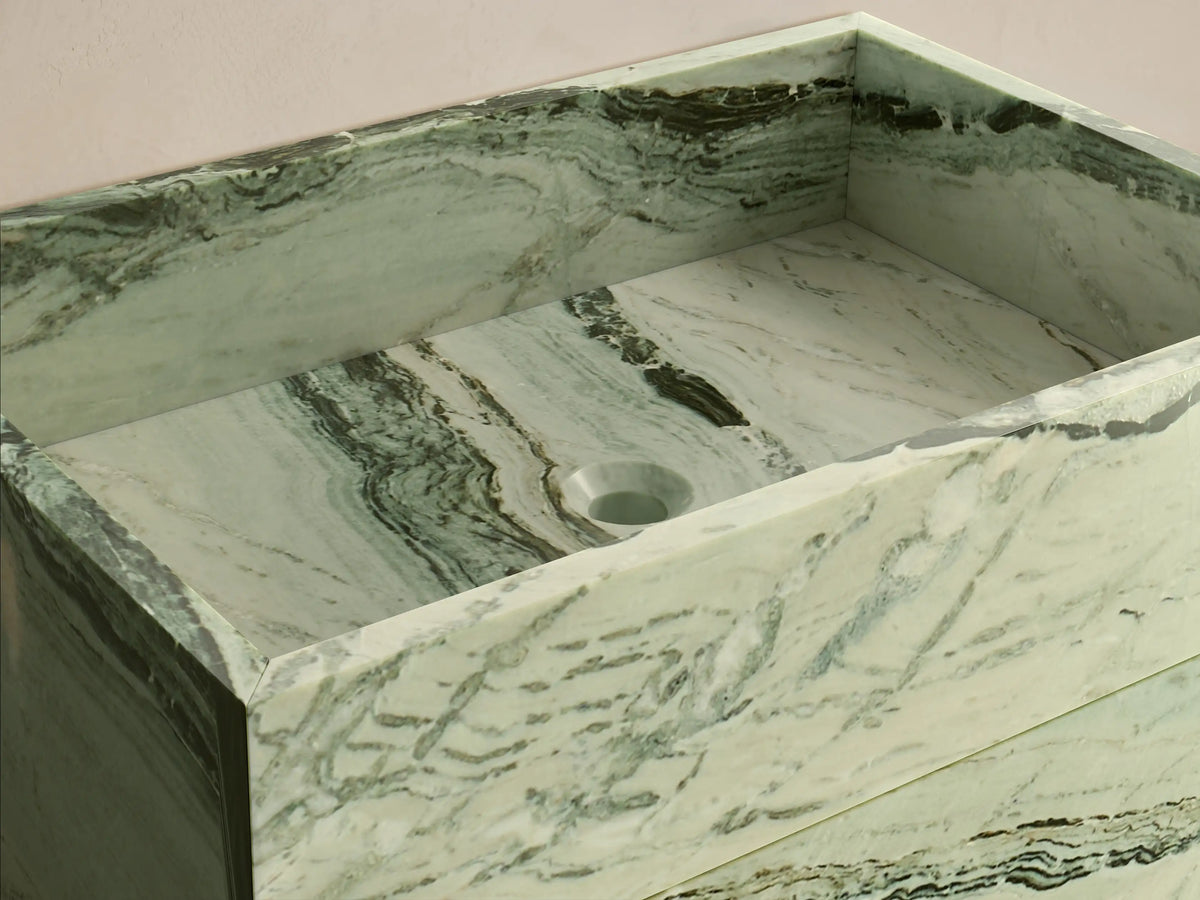 Front view of the light green natural stone Vertiz Pedestal Sink with Storage, featuring dark green and black veining.