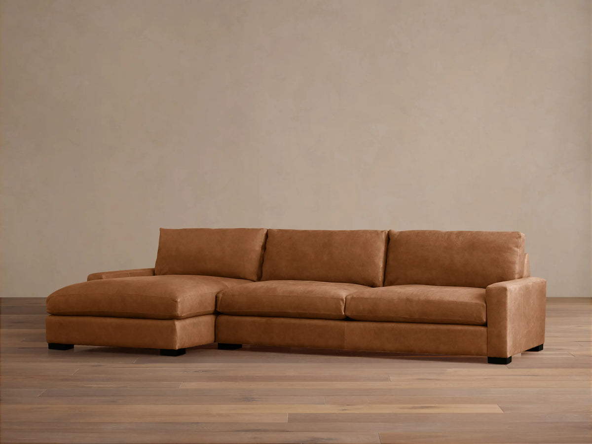Remington Leather Two-Piece Chaise Sectional, tan leather, left-facing chaise, on wooden floor with light wall.