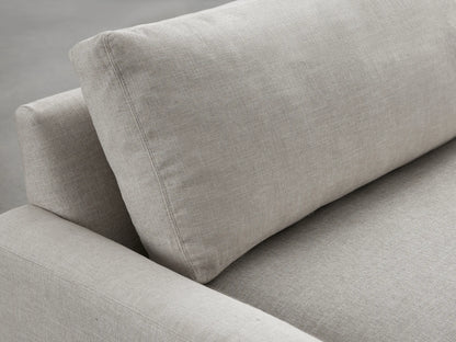 Modern Remington Sofa in light beige fabric, a two-seater with wide square arms and two seat cushions, against a gray studio background.