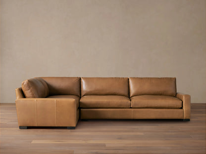 Remington Leather Two-Piece Sectional in Saratoga Chocolate, L-shaped, with soft brown leather & plump cushions on a wood floor.