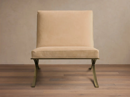 Front view of a light beige Moxie Leather Chair with a rectangular back, stitched seat cushion, and sculptural gold-toned metal legs.
