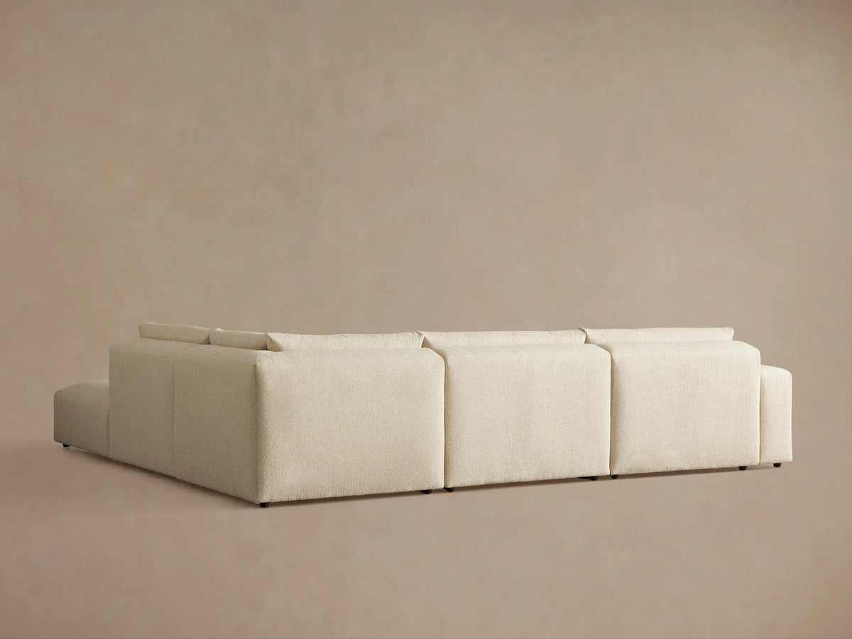 Keegan Tailored Five-Piece Sectional: Angled close-up of light beige textured fabric on seat and back cushions.
