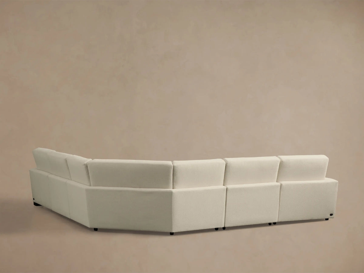 Close-up of the cream Remington Five-Piece Motion Corner Sectional with an extended recliner footrest.