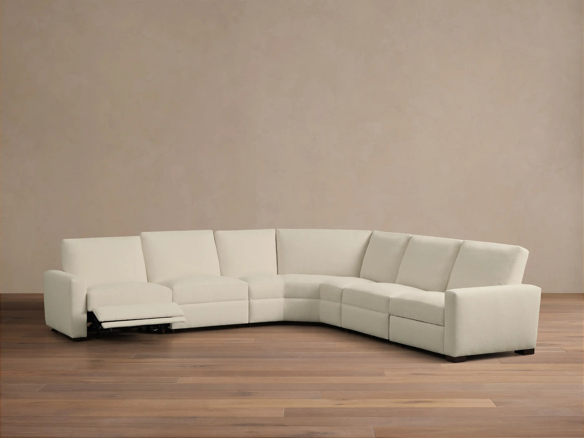 Rear view of the cream Remington Five-Piece Motion Corner Sectional, showing its five modular pieces.