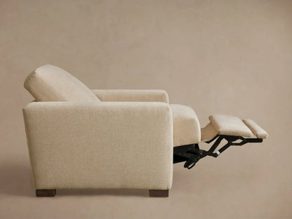 Front view of the light beige Remington Motion Recliner, upholstered in textured fabric, with its footrest partially extended.