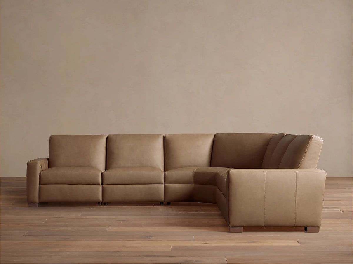 Remington Leather Five-Piece Motion Corner Sectional, L-shaped, in light brown leather on a wood floor against a light wall.