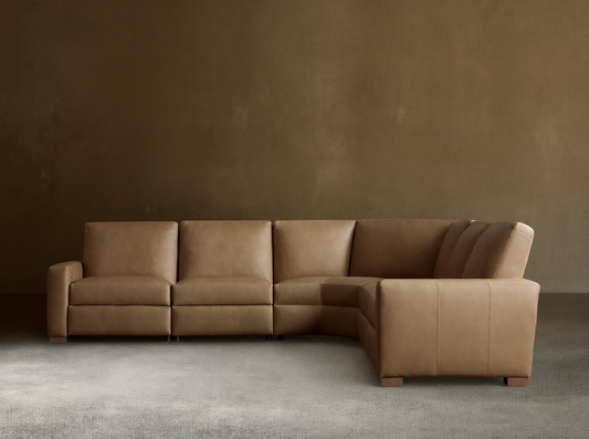 Remington Leather Five-Piece Motion Corner Sectional, L-shaped, in light brown leather on a wood floor against a light wall.