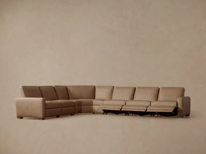 Tan Remington Leather Six-Piece Motion Sectional, rear view, curving broadly, on plain beige background.