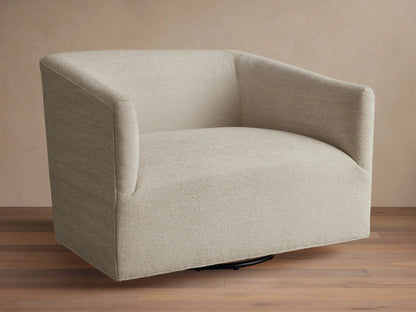 Oversized Ellison Swivel Chair, upholstered in light beige textured fabric, with curved arms & a visible black swivel base.