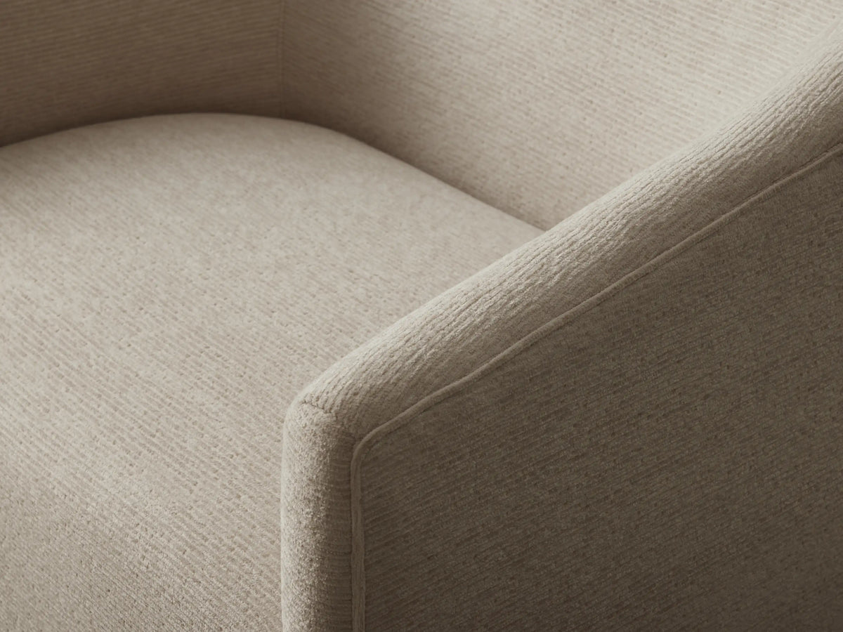 Ellison Oversized Swivel Chair upholstered in light beige textured fabric with rounded arms and a dark swivel base.