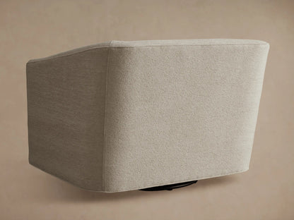Ellison Oversized Swivel Chair, light beige textured woven fabric. High-angle close-up of curved armrest and seat.