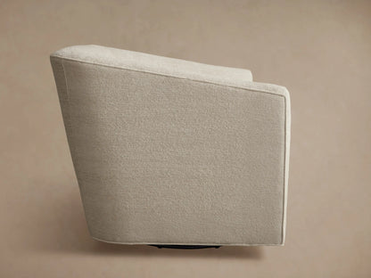 Ellison Oversized Swivel Chair, upholstered in light beige textured fabric, viewed from the back-side, showing its curved design.