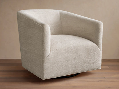 Ellison Swivel Glider, light beige textured fabric with curved arms and back, on a black swivel base on wood.