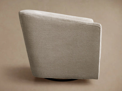Ellison Swivel Glider upholstered in light beige, subtly textured fabric, seen from the back-side with a dark swivel base.