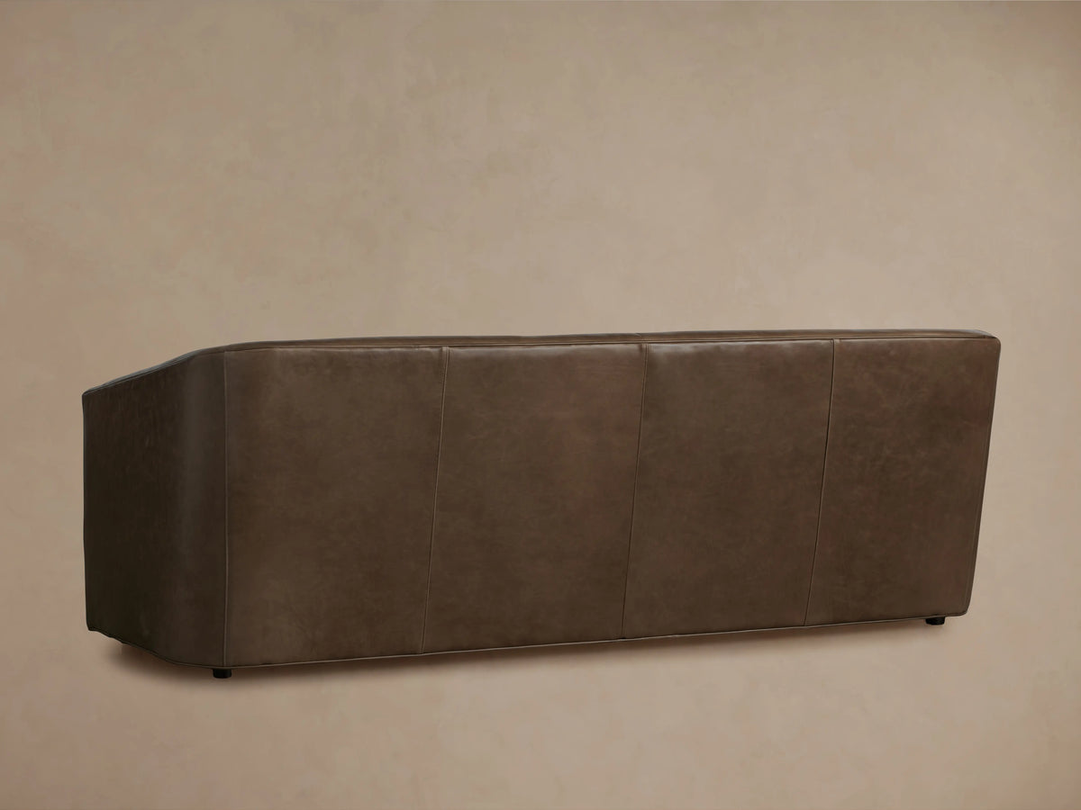 Ellison Leather Sofa corner view showcasing rich brown leather with visible natural texture, sleek armrest, and smooth surface.