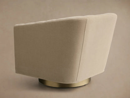 Side profile of a beige Ellison Channel-Stitched Metal Plinth Swivel Chair with channel-stitching and a gold metal plinth base.