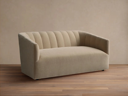 Ellison Channel-Stitched Sofa, light beige fabric, with a channel-stitched backrest and rounded arms, on a wood floor.