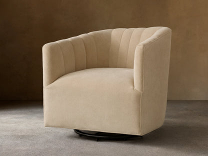 Front view of a Cream Ellison Channel-Stitched Swivel Glider with a curved back and vertical channel stitching.