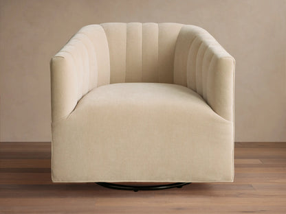 Close-up of the beige Ellison Channel-Stitched Swivel Glider, featuring visible channel stitching on the back and armrest.