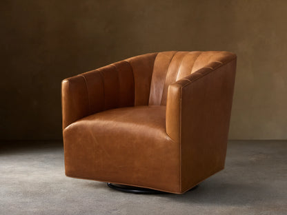 Ellison Leather Channel-Stitched Swivel Glider, a rich brown leather armchair with vertical channel stitching, angled on a wooden floor.