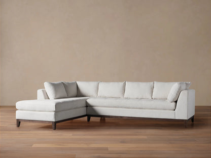 Bryden Two-Piece Daybed Sectional in light grey textured fabric with a left-facing chaise and dark wood base.
