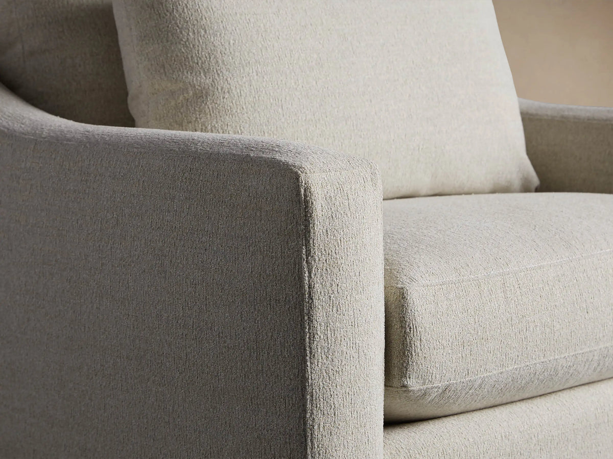 Ashby Swivel Chair: light greige textured fabric, square arms and base, plush back and seat cushions, front view.