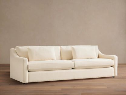 Front view of a cream Ashby Sofa with two large seat cushions, two back cushions, and two rectangular throw pillows.