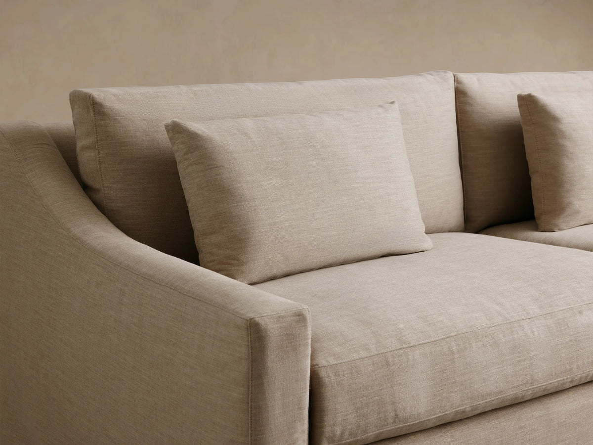 Light beige Ashby Slipcovered Sofa, 2-seater with full slipcover, two seat & two back cushions, two accent pillows.