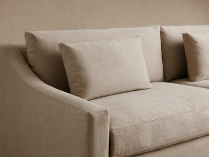 Light beige Ashby Slipcovered Sofa, 2-seater with full slipcover, two seat & two back cushions, two accent pillows.
