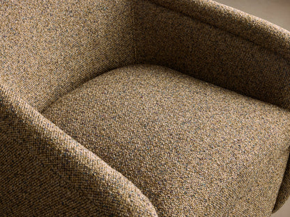 Ashbury Swivel Chair, rounded, upholstered in textured brown-green tweed fabric, with a black swivel base, on wood floor.