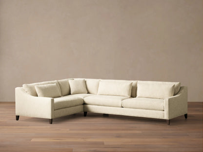 Front view of a cream Ashby Elevated Two-Piece Sectional, featuring a left-hand corner configuration and mocha wooden legs.