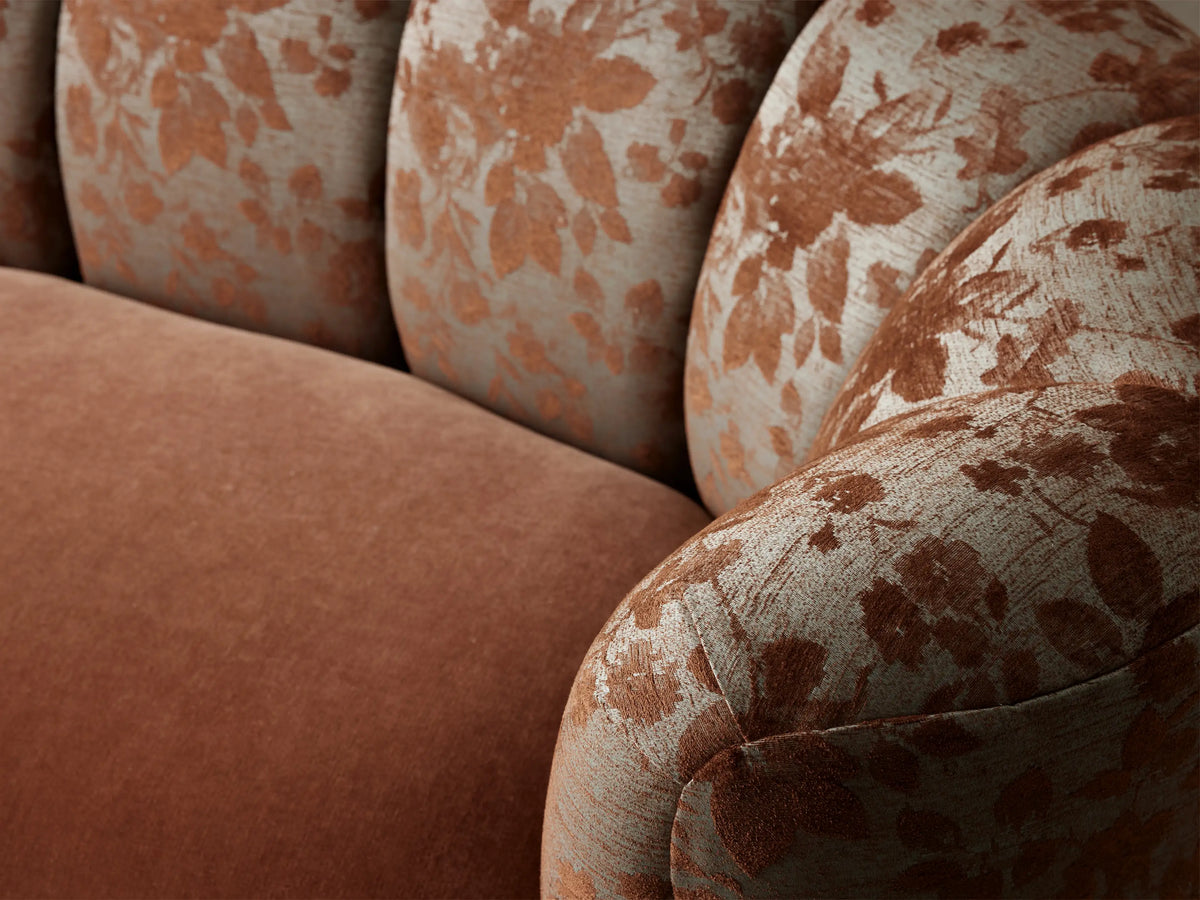 Amira Sofa: Cinnamon-colored seat & base; beige backrest & arms with brown floral pattern; fluted back.
