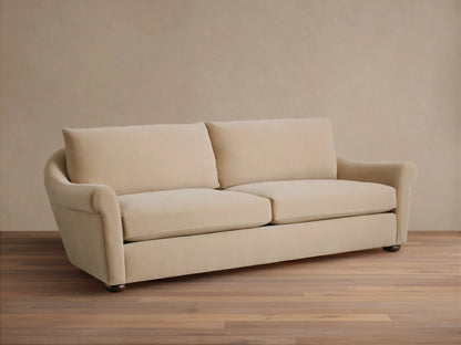 Front view of Cream Archwood Sofa with two seat and back cushions, rolled arms, and dark feet.