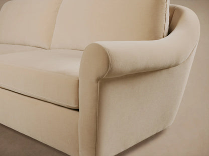 Front view of the cream Archwood Sofa, featuring rolled arms, two plump seat cushions, and two plush back cushions.