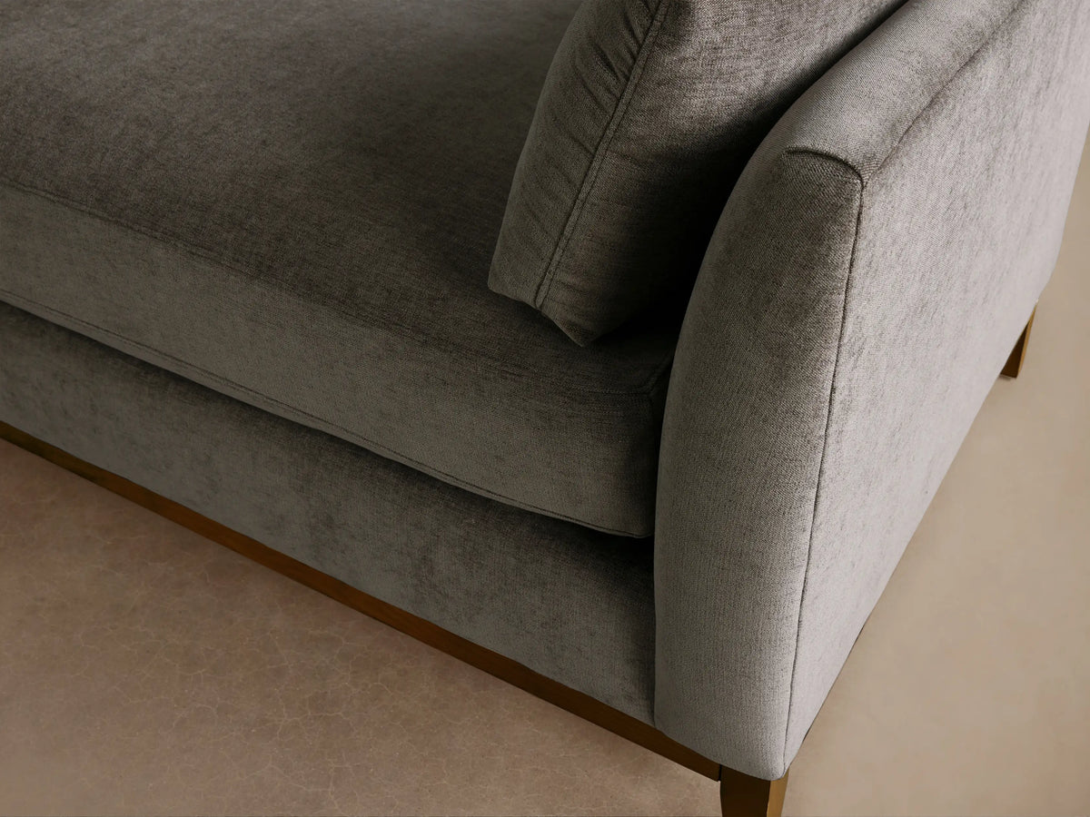 Bainbridge Daybed. Grey-green textured fabric, rectangular, with dark wood base, two loose cushions, on wood floor.