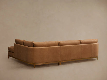 Bainbridge Leather Two-Piece Bumper Sectional close-up: supple tan leather, plush seat cushion, precise stitching, wooden base.