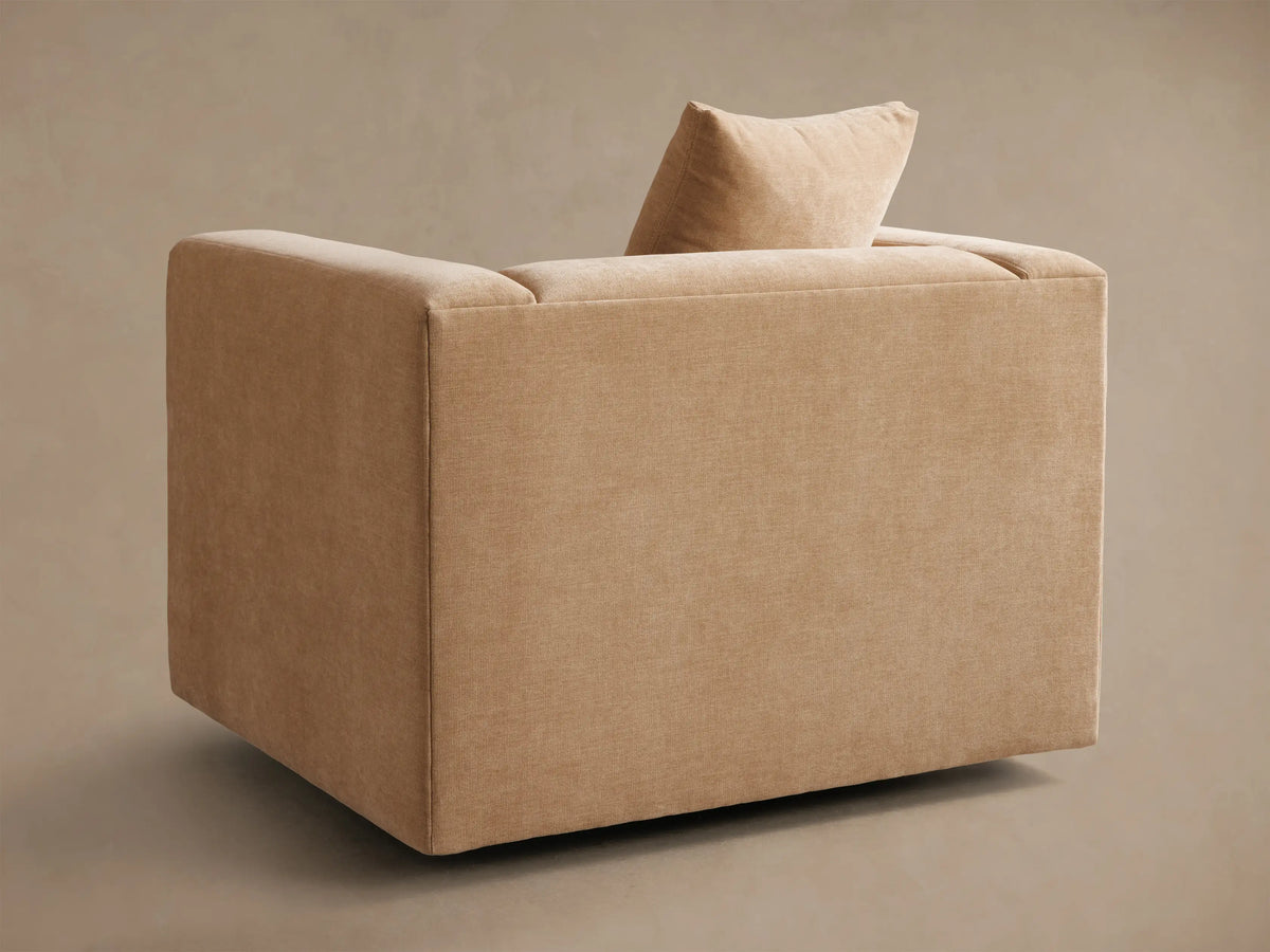 Back three-quarter view of a beige Brady Swivel Chair, featuring a single back cushion.