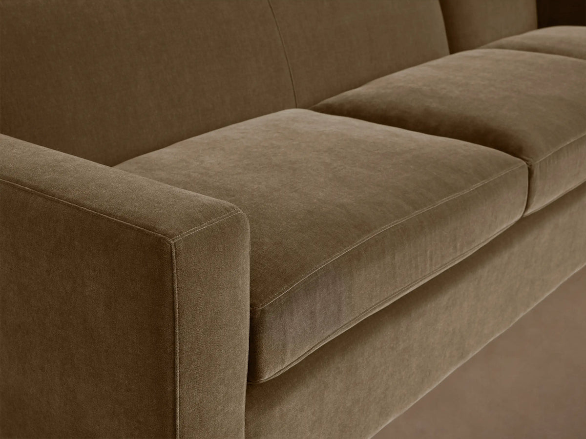 Bronte Three-Piece Corner Sectional in brown fabric, featuring plush cushions and a minimalist design on a hardwood floor.