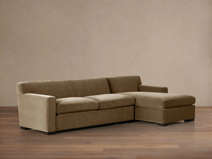 Bronte Two-Piece Chaise Sectional in muted olive green, with a right-facing chaise, on a wood floor against a light wall.