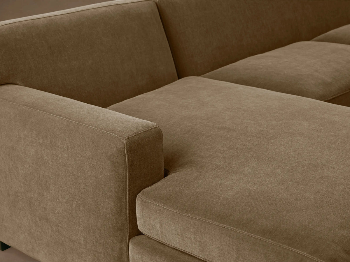Bronte Two-Piece Chaise Sectional, soft muted olive-brown fabric, with a left-facing chaise, on wooden floor.