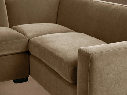 Bronte Two-Piece Sectional, L-shaped, in muted olive green fabric, with dark block legs on a hardwood floor.