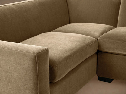 Bronte Two-Piece Sectional in plush muted olive green, L-shaped, on wood floor against a light wall.