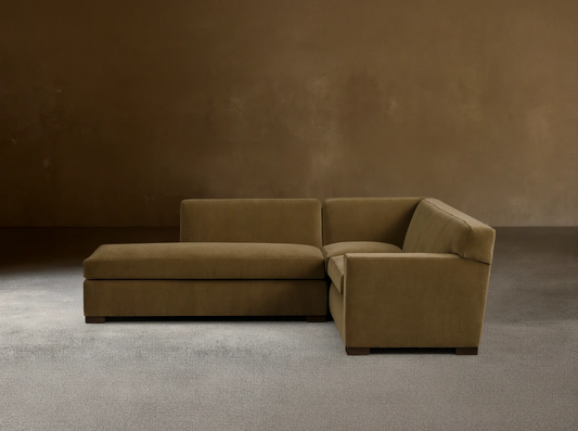 Front view of the olive green Bronte Two-Piece Bumper Chaise Sectional with square arms and dark block legs.