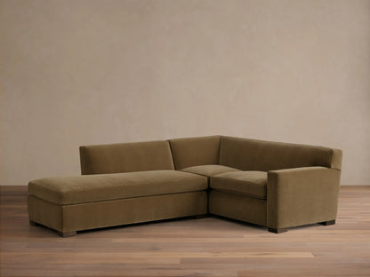 Front view of the olive green Bronte Two-Piece Bumper Chaise Sectional with square arms and dark block legs.