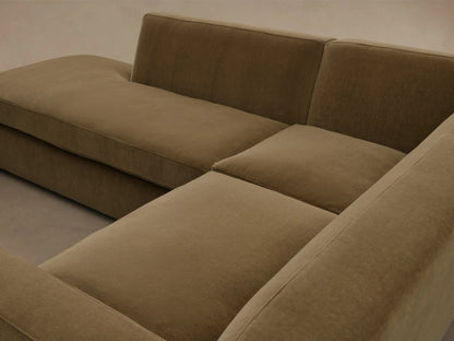Front view of the olive green Bronte Two-Piece Bumper Chaise Sectional, featuring an L-shape with a long chaise lounge.