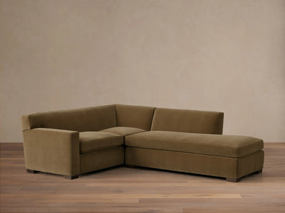 Front view of an olive green Bronte Two-Piece Bumper Chaise Sectional, showing its L-shaped design and clean lines.