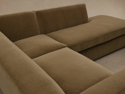 Front view of the Olive Bronte Two-Piece Bumper Chaise Sectional, an L-shaped sofa with thick cushions and dark wood feet.