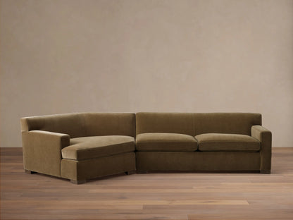 Front view of the olive green velvet Bronte Two-Piece Cuddle Chaise Sectional, featuring a left-arm chaise.